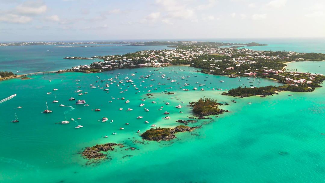 Aerial view of boats moored in a turquoise Bermuda harbour